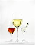 A glass of white wine, a martini and a glass of sherry