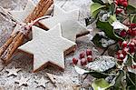 Cinnamon stars with icing sugar and Christmas decorations