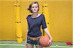 Teenage Girl Holding Basketball