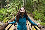 Young Woman on Rustic Bridge