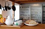 Fruits, Bread And Tea Set In Kitchen