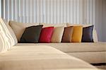 Multicolored Cushion In A Row On Sofa