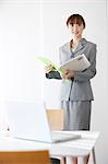 Japanese Business Woman Holding Documents