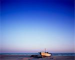 Boat On The Beach At Dusk