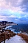 Beautiful Beach Scene With Cliff In Background