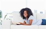 Portrait of a happy  woman holding a book