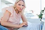 Portrait of a blonde on a laptop