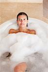 Woman relaxing in the tub