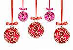 Red and Pink Christmas balls with bows on white background