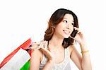 happy  woman holding shopping bag and talking on the phone