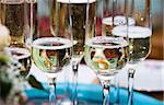 Golden champagne sparkle with fluted glasses and party ribbons