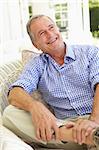 Portrait Of Senior Man Relaxing In Chair