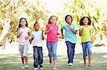 Group Of Children Running Through Park