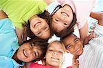 Group Of Children Looking Down Into Camera