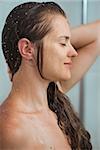 Portrait of relaxed woman with long hair in shower