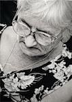 Old image of an unhappy senior woman-NOTE:Texture was added to simulate an old image.