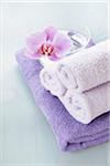 Rolled Towels and Orchid in Bowl of Water