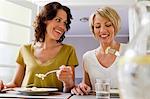 Smiling women having lunch together