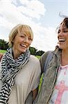 Smiling women walking together outdoors