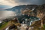 Waves crashing on rocky cliffs