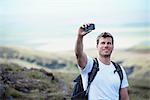 Hiker taking picture with cell phone