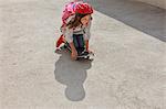 Girl riding skateboard outdoors