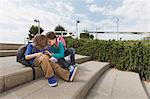 Children talking on steps outdoors