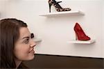 Woman examining shoes in store