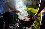 Two men barbecueing