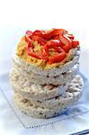Stack of Rice Cakes with Top Cap Topped with Hummus and Roasted Red Peppers