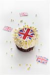 A cupcake topped with cream and a Union Jack