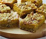 Pumpkin Dessert Bars on a Wooden Cutting Board