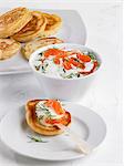 Blinis topped with salmon and yogurt
