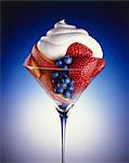 Fresh Fruit Salad in a Stem Glass Topped with Whipped Cream