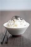 A bowl of rice with black sesame seeds