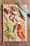 Chopped Red Potato, Carrots and Celery with Thyme on a Cutting Board; From Above