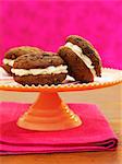 Chocolate and ginger whoopie pies filled with cream