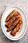 Stuffed, fried celery on a plate