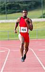 Male athlete running on track
