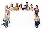 Group of people holding blank notice board