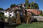 A water wheel at the entrance gate of the ancient city  of Lijiang, Yunnan Province, China