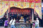 Worshippers offering incense at Pak Tai Temple during the Bun festival, Cheung Chau, Hong Kong