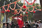 People beating drum for a wish during the Chinese New Year at Po Lin Monastery, Lantau Island, Hong Kong