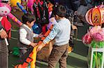 Boys playing with the balloons at the fllower market, Tsuen Wan, Hong Kong