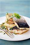 Bass fillet with artichoke bases and basil