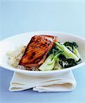 Thick piece of grilled salmon with  rice and pak choï cabbage