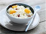 Rice pudding with sliced dates and orange