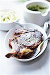 Grilled beef chop and mashed potatoes with herb butter