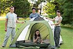 Young campers camping on field