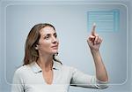 Woman looking at her schedule of the day on advanced touch screen interface